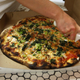 A takeout pizza at Frank Pepe Pizzeria, the birthplace of New Haven-style pizza